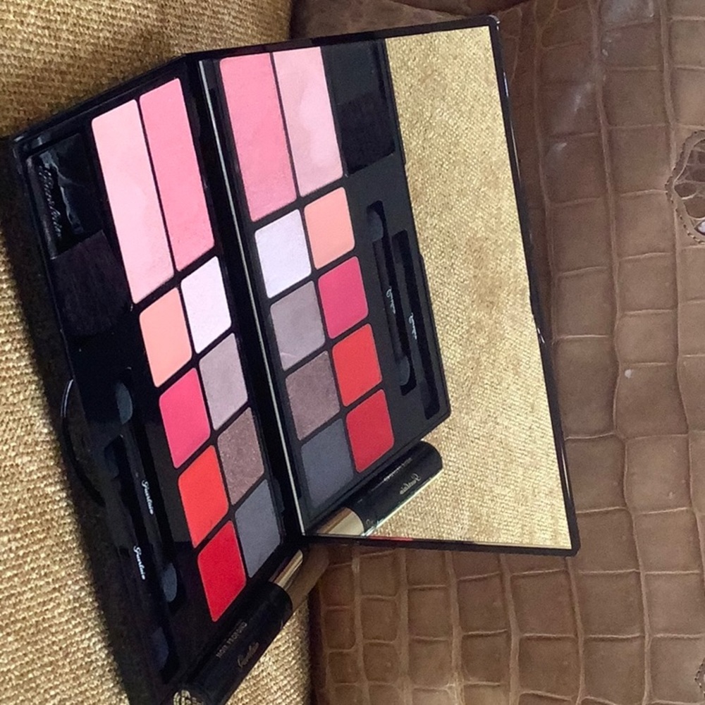 Guerlain makeup palette with eyeshadow lipstick brush and wands and mascara